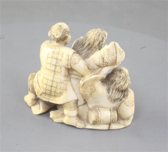 A Japanese ivory okimono netsuke of three Samurai warriors fighting, width 5.6cm